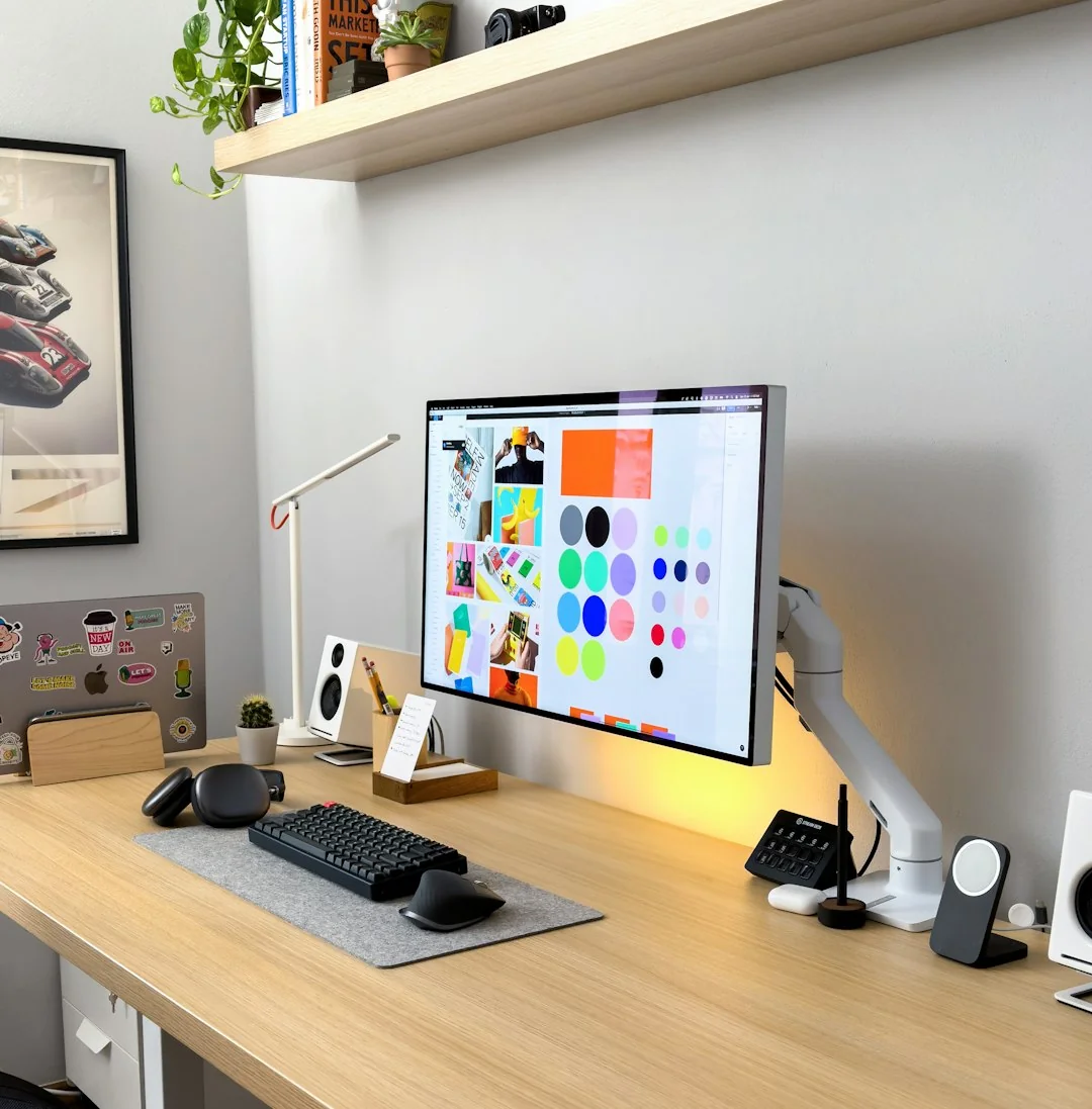 A person working on a laptop while browsing stock photo websites. Freelancing tasks in a comfortable setting.